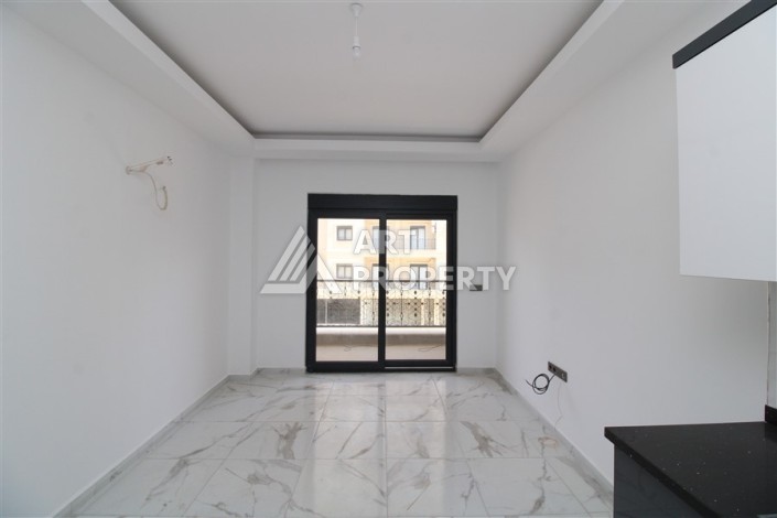 Новая квартира 1+1 в современном доме в районе Махмутлар — 500 м до моря. - Ракурс 4