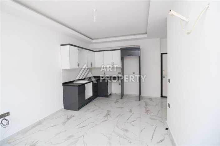 Новая квартира 1+1 в современном доме в районе Махмутлар — 500 м до моря. - Ракурс 7