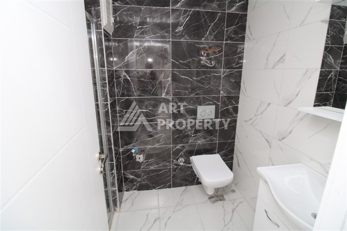 Новая квартира 1+1 в современном доме в районе Махмутлар — 500 м до моря. - Ракурс 9