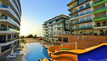 Просторная меблированная квартира 2+1 в элитном комплексе в районе Каргыджак — 300 метров до моря. - Ракурс 1