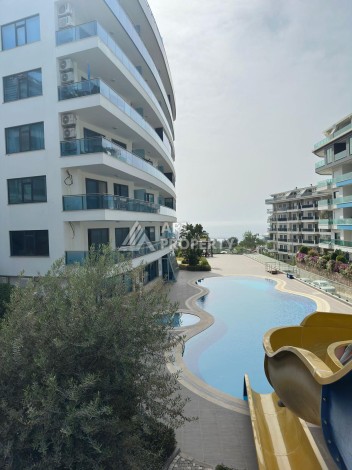 Просторная меблированная квартира 2+1 в элитном комплексе в районе Каргыджак — 300 метров до моря. - Ракурс 18