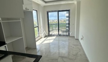 Уютная 1+1 квартира в новом комплексе в районе Демирташ - Ракурс 8