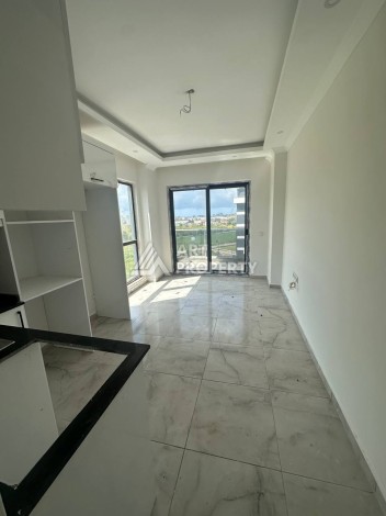 Уютная 1+1 квартира в новом комплексе в районе Демирташ - Ракурс 7