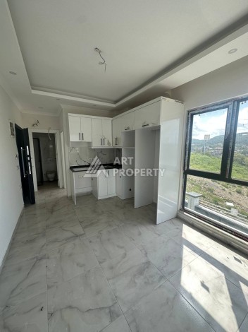 Уютная 1+1 квартира в новом комплексе в районе Демирташ - Ракурс 8