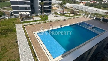 Уютная 1+1 квартира в новом комплексе в районе Демирташ - Ракурс 13