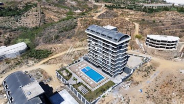 Уютная 1+1 квартира в новом комплексе в районе Демирташ - Ракурс 22