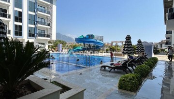 Квартира 1+1 с застекленным балконом в Оба, 55 кв.м. - Ракурс 1