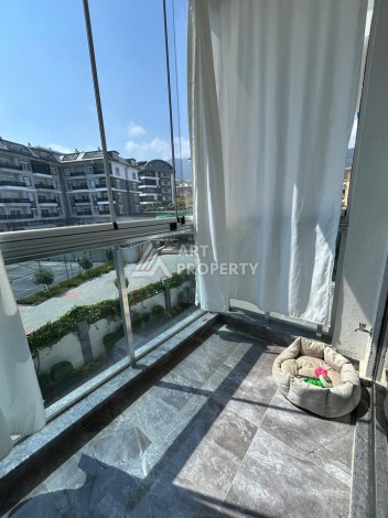 Квартира 1+1 с застекленным балконом в Оба, 55 кв.м. - Ракурс 3