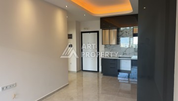 Современная квартира 1+1 в премиальном комплексе в районе Махмутлар - Ракурс 3