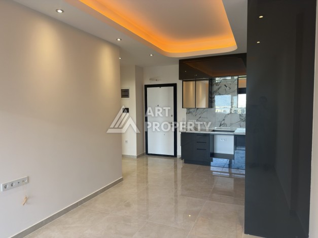 Современная квартира 1+1 в премиальном комплексе в районе Махмутлар - Ракурс 2