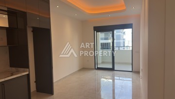 Современная квартира 1+1 в премиальном комплексе в районе Махмутлар - Ракурс 6