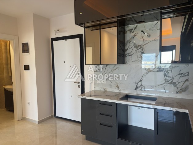 Современная квартира 1+1 в премиальном комплексе в районе Махмутлар - Ракурс 9