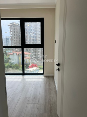 Квартира 2+1 в Махмутларе по выгодной цене, 70 кв.м. - Ракурс 12