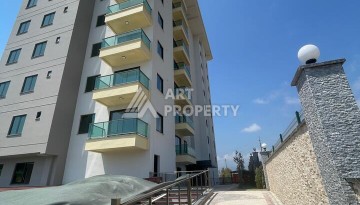 Квартира 2+1 с видом на море в Махмутларе, 90 кв.м. - Ракурс 3