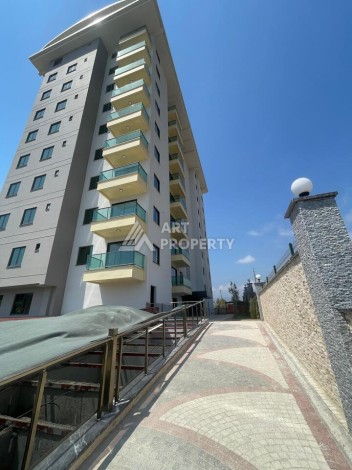 Квартира 2+1 с видом на море в Махмутларе, 90 кв.м. - Ракурс 2