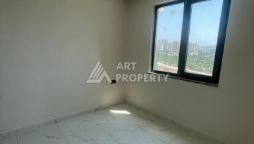 Квартира 2+1 с видом на море в Махмутларе, 90 кв.м. - Ракурс 4