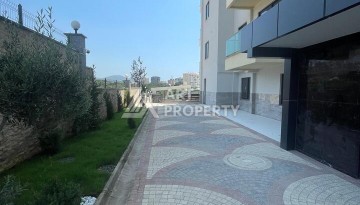 Квартира 2+1 с видом на море в Махмутларе, 90 кв.м. - Ракурс 21