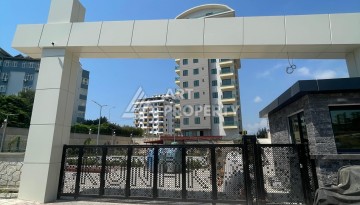 Квартира 2+1 с видом на море в Махмутларе, 90 кв.м. - Ракурс 31