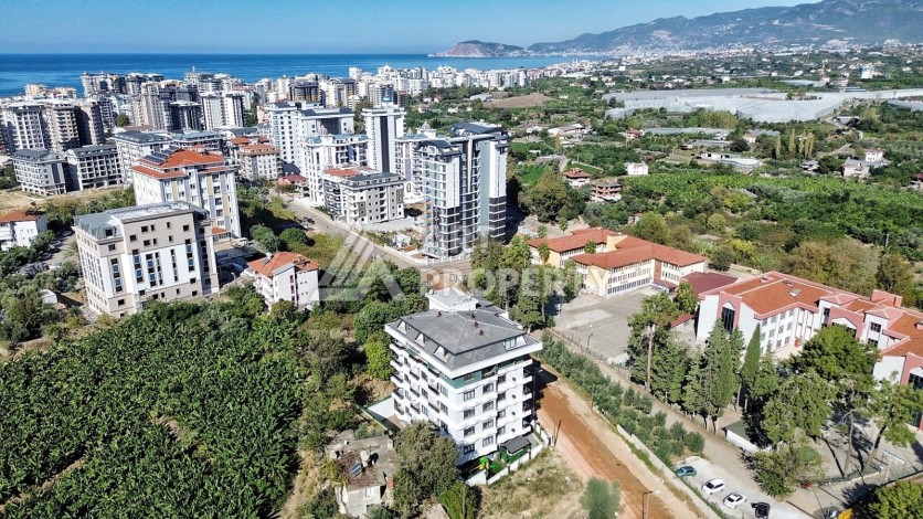 Квартира 1+1 в камерном ЖК, 55 м².   Махмутлар, Алания - Ракурс 0