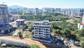 Квартира 1+1 в камерном ЖК, 55 м².   Махмутлар, Алания - Ракурс 4