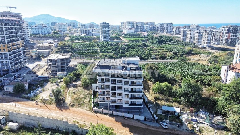 Квартира 1+1 в камерном ЖК, 55 м².   Махмутлар, Алания - Ракурс 3