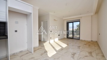 Квартира 1+1 в камерном ЖК, 55 м².   Махмутлар, Алания - Ракурс 6