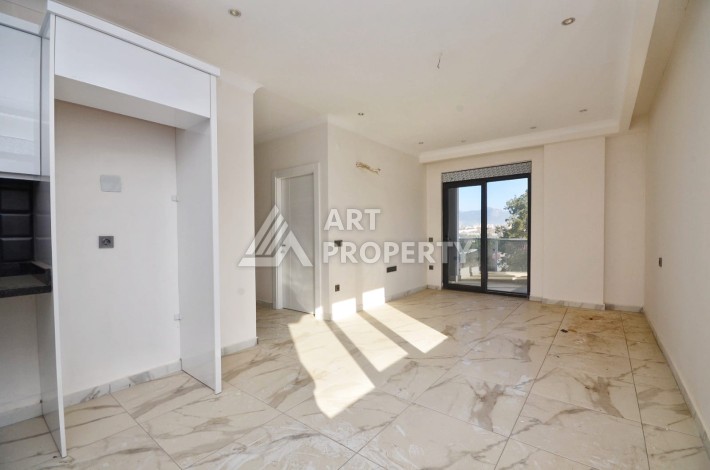 Квартира 1+1 в камерном ЖК, 55 м².   Махмутлар, Алания - Ракурс 5