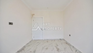 Квартира 1+1 в камерном ЖК, 55 м².   Махмутлар, Алания - Ракурс 8