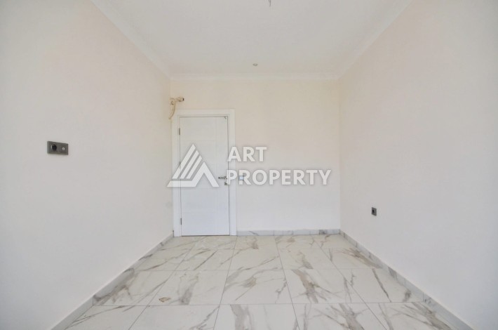 Квартира 1+1 в камерном ЖК, 55 м².   Махмутлар, Алания - Ракурс 7