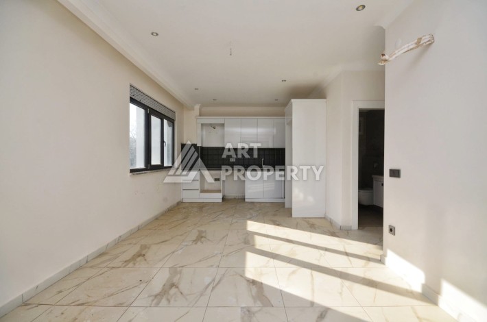 Квартира 1+1 в камерном ЖК, 55 м².   Махмутлар, Алания - Ракурс 8