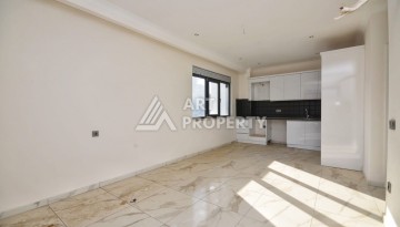 Квартира 1+1 в камерном ЖК, 55 м².   Махмутлар, Алания - Ракурс 10