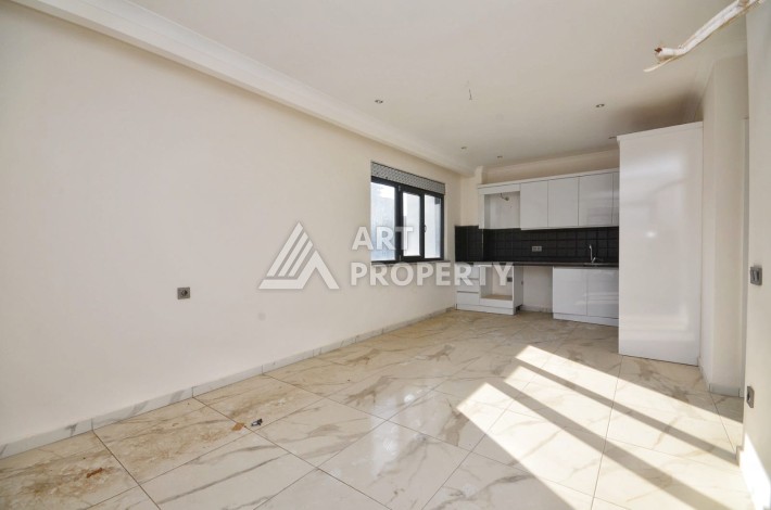 Квартира 1+1 в камерном ЖК, 55 м².   Махмутлар, Алания - Ракурс 9