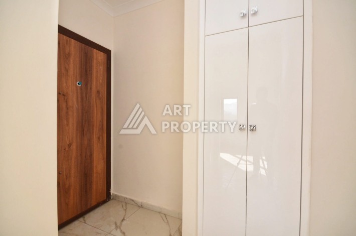 Квартира 1+1 в камерном ЖК, 55 м².   Махмутлар, Алания - Ракурс 11