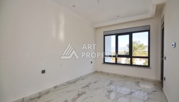 Квартира 1+1 в камерном ЖК, 55 м².   Махмутлар, Алания - Ракурс 13