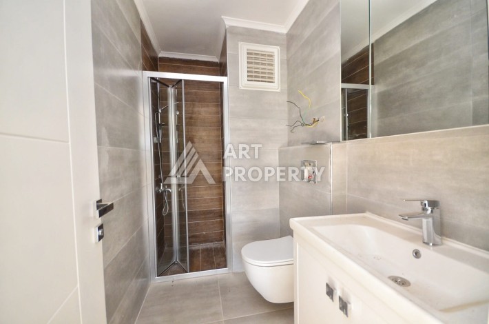 Квартира 1+1 в камерном ЖК, 55 м².   Махмутлар, Алания - Ракурс 15