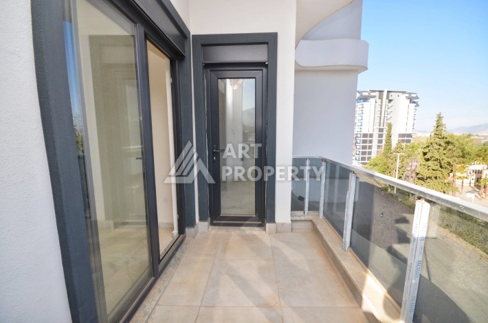 Квартира 1+1 в камерном ЖК, 55 м².   Махмутлар, Алания - Ракурс 17
