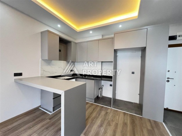 Квартира 1+1 с приватным садом в Авсалларе, 50 кв.м. - Ракурс 1