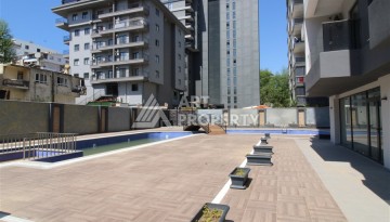 Новые квартиры 1+1 в современном комплексе в Махмутларе, 650 метров до моря - Ракурс 13