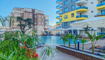 Квартира 1+1 в Махмутларе с видом на горы, 58 кв.м. - Ракурс 1