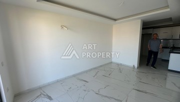 Квартира 1+1 в Махмутларе с видом на горы, 58 кв.м. - Ракурс 3