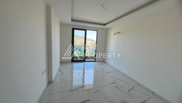 Квартира 1+1 в Махмутларе с видом на горы, 58 кв.м. - Ракурс 6