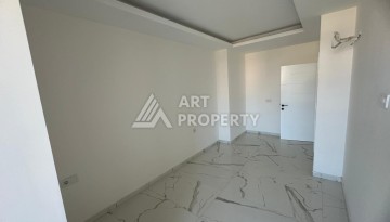 Квартира 1+1 в Махмутларе с видом на горы, 58 кв.м. - Ракурс 7
