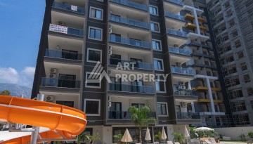 Квартира 1+1 в центре Махмутлара, 55 кв.м. Срочная продажа - Ракурс 1