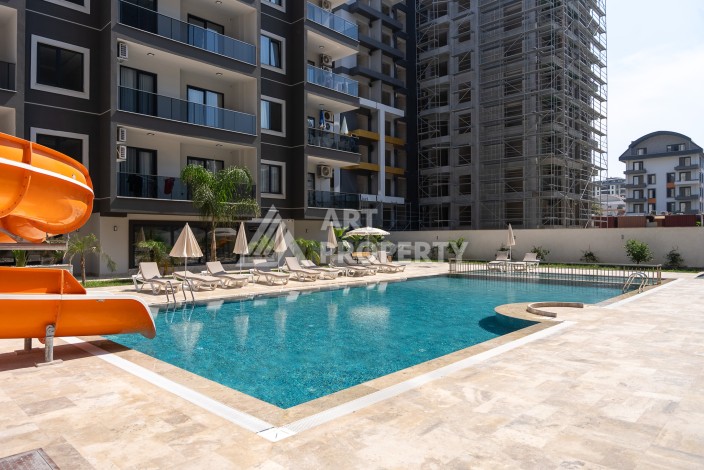 Квартира 1+1 в центре Махмутлара, 55 кв.м. Срочная продажа - Ракурс 24