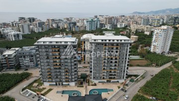 Квартира 1+1 в новом ЖК, 55 кв.м. Махмутлар, Алания - Ракурс 1