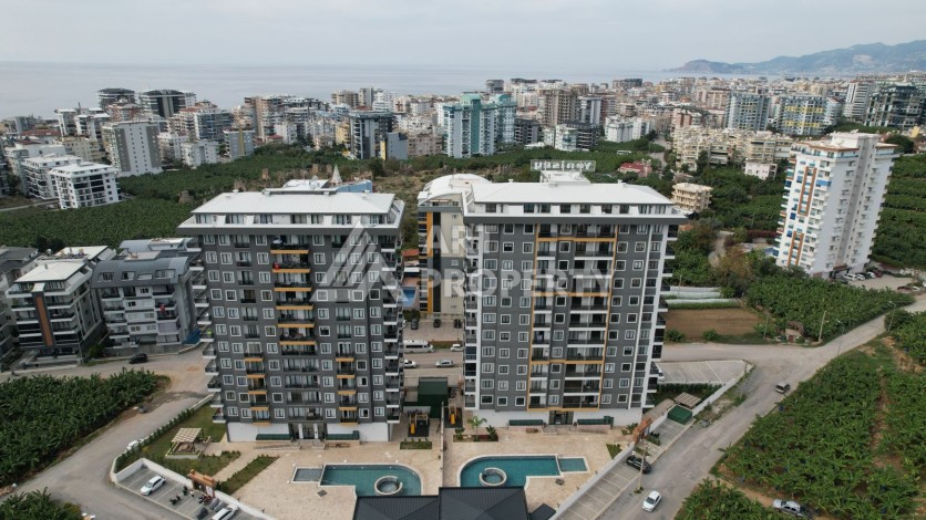 Квартира 1+1 в новом ЖК, 55 кв.м. Махмутлар, Алания - Ракурс 0