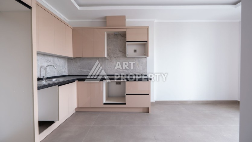 Квартира 1+1 в новом ЖК, 55 кв.м. Махмутлар, Алания - Ракурс 2