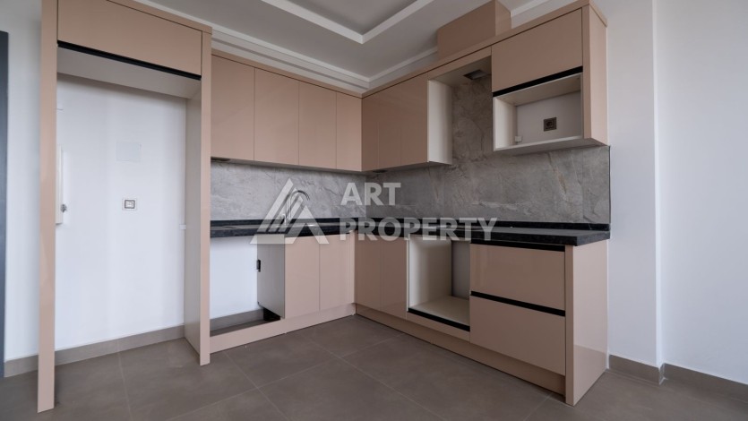 Квартира 1+1 в новом ЖК, 55 кв.м. Махмутлар, Алания - Ракурс 3