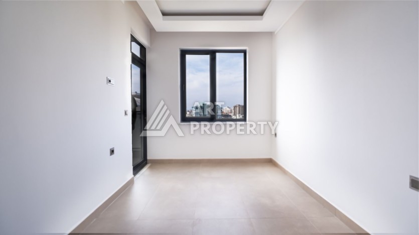 Квартира 1+1 в новом ЖК, 55 кв.м. Махмутлар, Алания - Ракурс 4