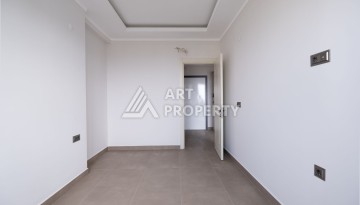 Квартира 1+1 в новом ЖК, 55 кв.м. Махмутлар, Алания - Ракурс 8